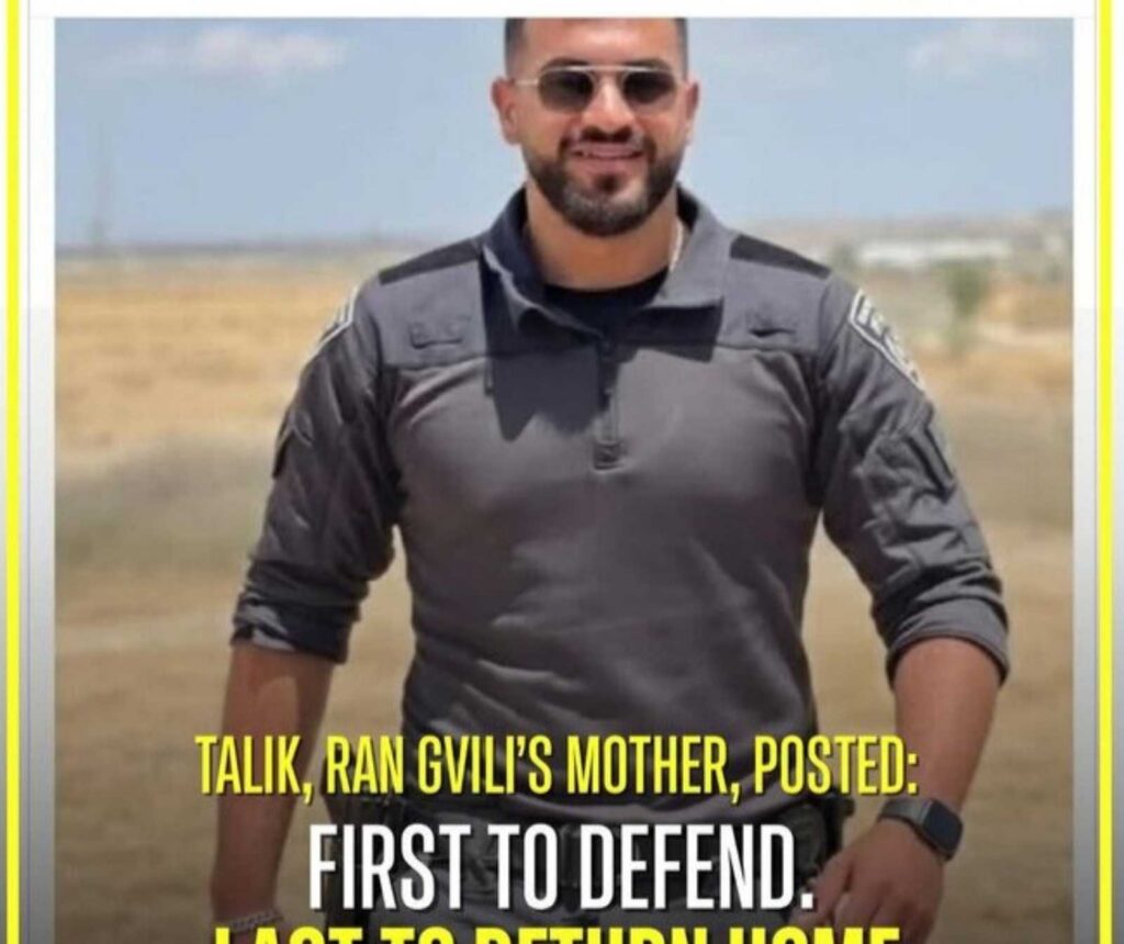 Ein junger Mann mit Sonnenbrille, er lächelt. Aufschrift zu lesen: Talik, Ran Gvili's mother posted: First to defend